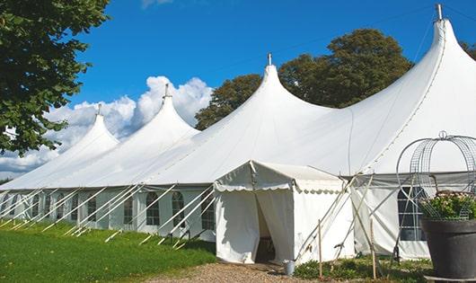 a line of sleek and modern portable toilets ready for use at an upscale corporate event in Peninsula